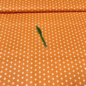 Narancssárga alapon fehér csillag mintás pamut karton