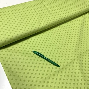 Élénkzöld alapon sötétzöld borsópötty mintás pamut karton