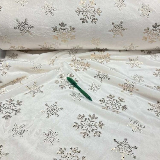 Ekrü alapon fényes, hópehely mintás léda